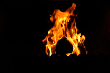 Fototapeta premium Fire flame on black background. Blaze fire flame textured background. Texture of fire on a black background. Abstract Fire flames isolated 