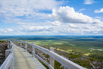 Fototapeta na wymiar View of the wooden walkway on the top of Levitunturi, Kittila, Lapland, Finland
