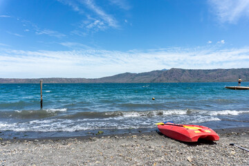 rocky beach and lake with kayak
