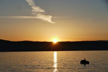 Orange sunset sky and peaceful sea