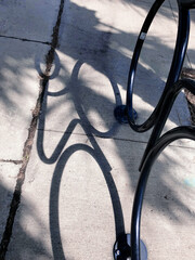 Shadow silhouette of a sculpture of a cyclist 