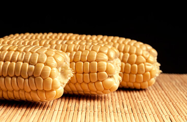 Sweet fresh corn on black background