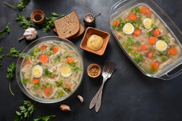 Home made aspic, jellied chicken meat with herbs and carrots. Traditional Russian dish holodets. Served with bread and mustard or/and horseradish
