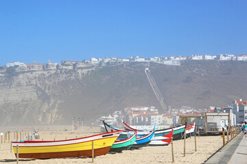 Traditional fishing boats on Nazare beach, Portugal
