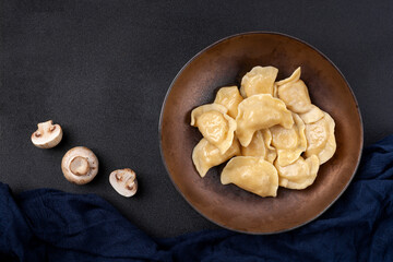 Plate with dumplings called vareniki, made from dough with meat or vegetable filling