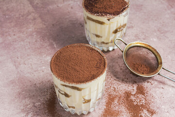 Classic tiramisu dessert in a glass. Copy space for text, view from above