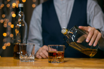 Barman pouring whiskey whiskey glass beautiful night