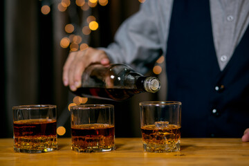 Barman pouring whiskey whiskey glass beautiful night