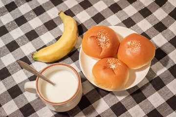 breakfast,breads,milk and banana on the table