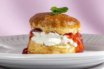 Assortment of homemade scones with ham, cheese, avocado, salmon, cream cheese and strawberry jam