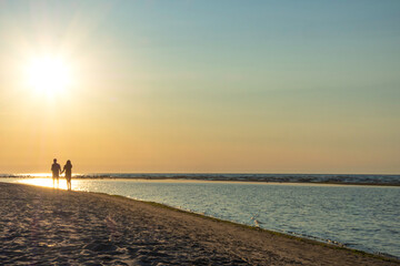 Fototapeta premium couple of two people in love at sunset