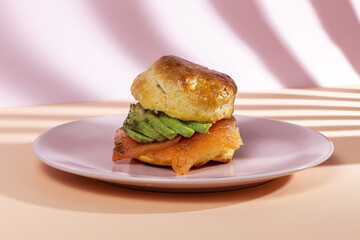 Assortment of homemade scones with ham, cheese, avocado, salmon, cream cheese and strawberry jam