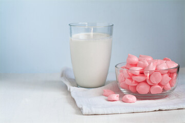 glass of milk and pink meringue