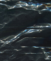 photo texture crumpled polyethylene of a dark shade of color