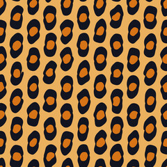 Leopard print. Trendy animal seamless vector pattern. Safari style background with cheetah pattern in warm colors