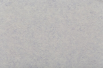 Violet plaster. Stucco relief. Rough background and texture.