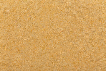 Yellow, orange plaster. Stucco relief. Rough background and texture.