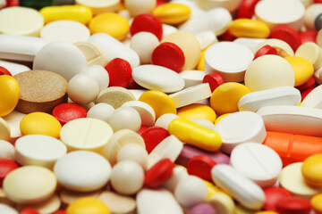 Different colorful tablets at white background