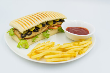 Grilled chicken sandwich with Sause and fries on the side.  