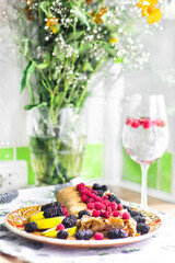 apple strudel with cinnamon from puff pastry with raspberries, mulberries