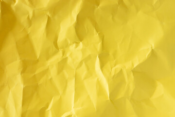Obraz premium Crumpled yellow paper texture flat lay