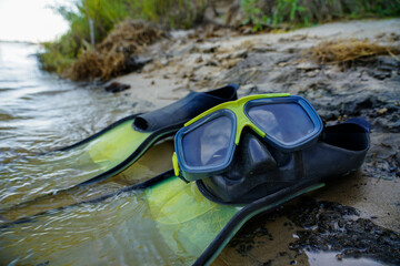 fins with a mask for diving in the water on the island