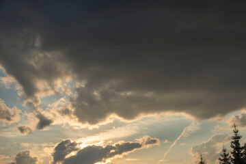 dark cumulus clouds white window among the dark sky