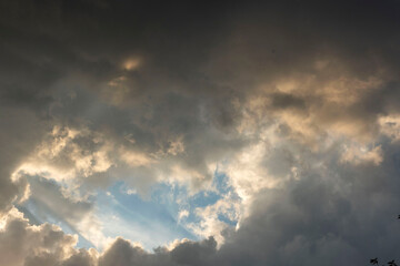 dark cumulus clouds white window among the dark sky