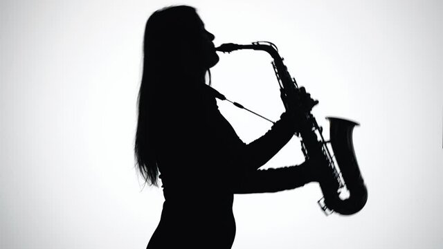 Saxophone Player. Black Silhouette on White Background