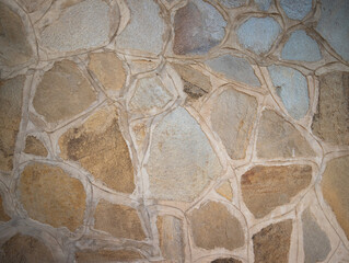 decorated stone wall in the garden of a villa in Sardinia
