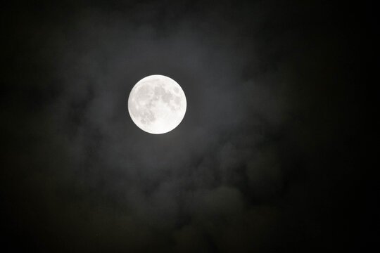 full moon in a black sky - Powered by Adobe