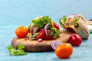 Homemade pita with vegetables, salad, fried Turkey and egg.