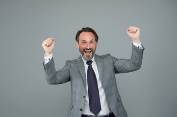 Victory is the goal. Happy businessman celebrate victory. Mature man with raised hands grey background. Victory and success. Winner and champion. Nothing less than victory