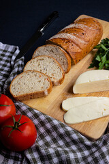 sliced bread with cheese and tomatoes