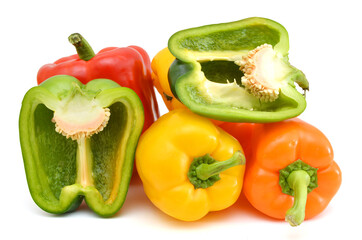 fresh green, red and yellow paprika isolated on white