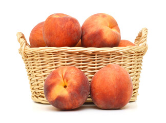 Ripe peach fruit isolated in basket  on white background