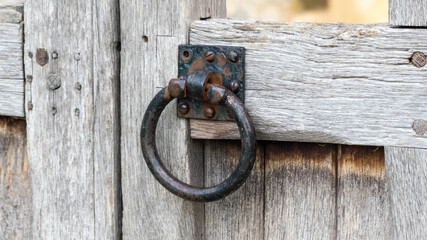 old bleached wooden gate rusty latch handle