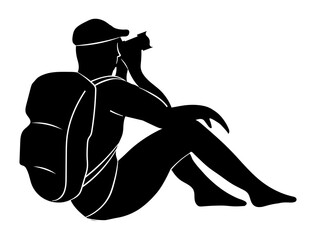 Silhouette of man with a camera isolated on white background. Photographer with a backpack on his shoulders is siting and taking a photo. Cameraman at working or tourist on vacation taking a picture