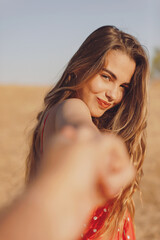 Fototapeta premium Happy young woman in love holds my hand