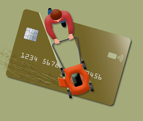 A man uses his lawn mower to cut up a huge credit card. View is from above looking down. .