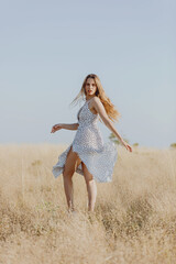 young woman jumping in the field