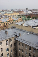 Saint-Petersburg, Russia - 10.06.20. Cityscape panorama of old central city part, view from a roof. Famous rooftops of St. Petersburg with Saint Isaac's Cathedralat the background.