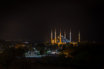 Sultanahmet (Blue Mosque) with its six minarets and dome illuminated in Istanbul, Turkey 