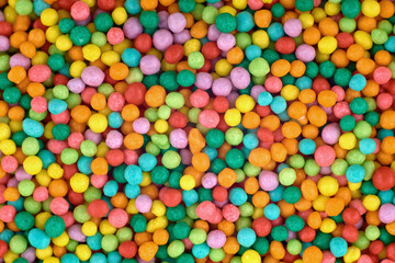 Fototapeta na wymiar Colorful candies abstract background, copy space. Sweets texture. Top view, flat lay