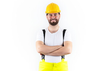 Attractive young construction worker with yellow helmet. young male technician smiling. engineering and technical service concept.
