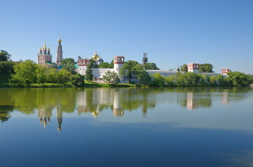 Fototapeta na wymiar Summer view of the Novodevichy monastery from the Big Novodevichy pond. Moscow, Russia