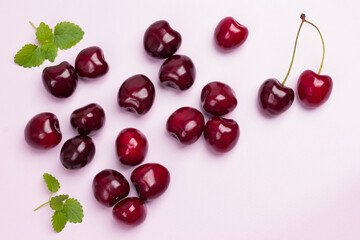 Berries of cherry on pink background.