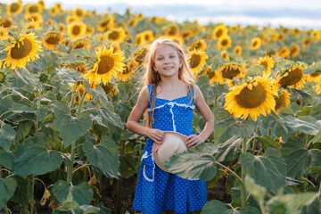 Girl with a hat in a sunflower field