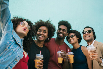 Multi-ethnic group of friends taking a selfie.
