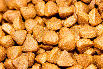 Dry food triangular shape for animals close-up.
